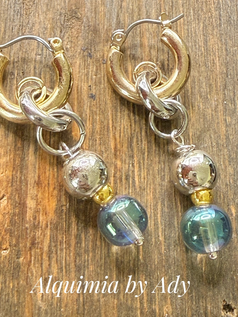 mixed gold and silver hoop earrings with iridescent teal quartz beads